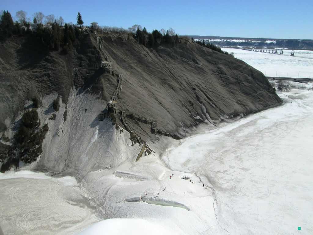 frozen Saint Lawrence River and Montmorency Falls in Quebec